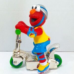 SESAME STREET ELMO ON SCOOTER